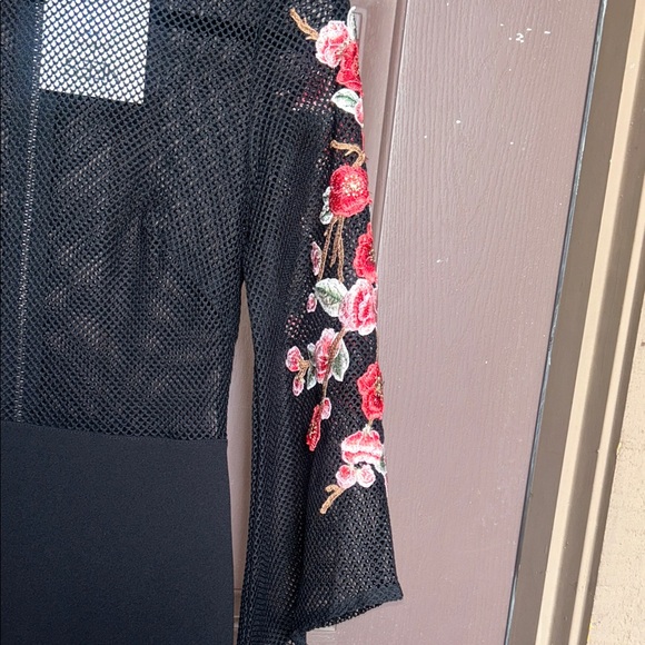 Elegant Black Dress with Floral Accents - Picture 4 of 13